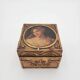 Old jewelry box in wood and gilded stucco