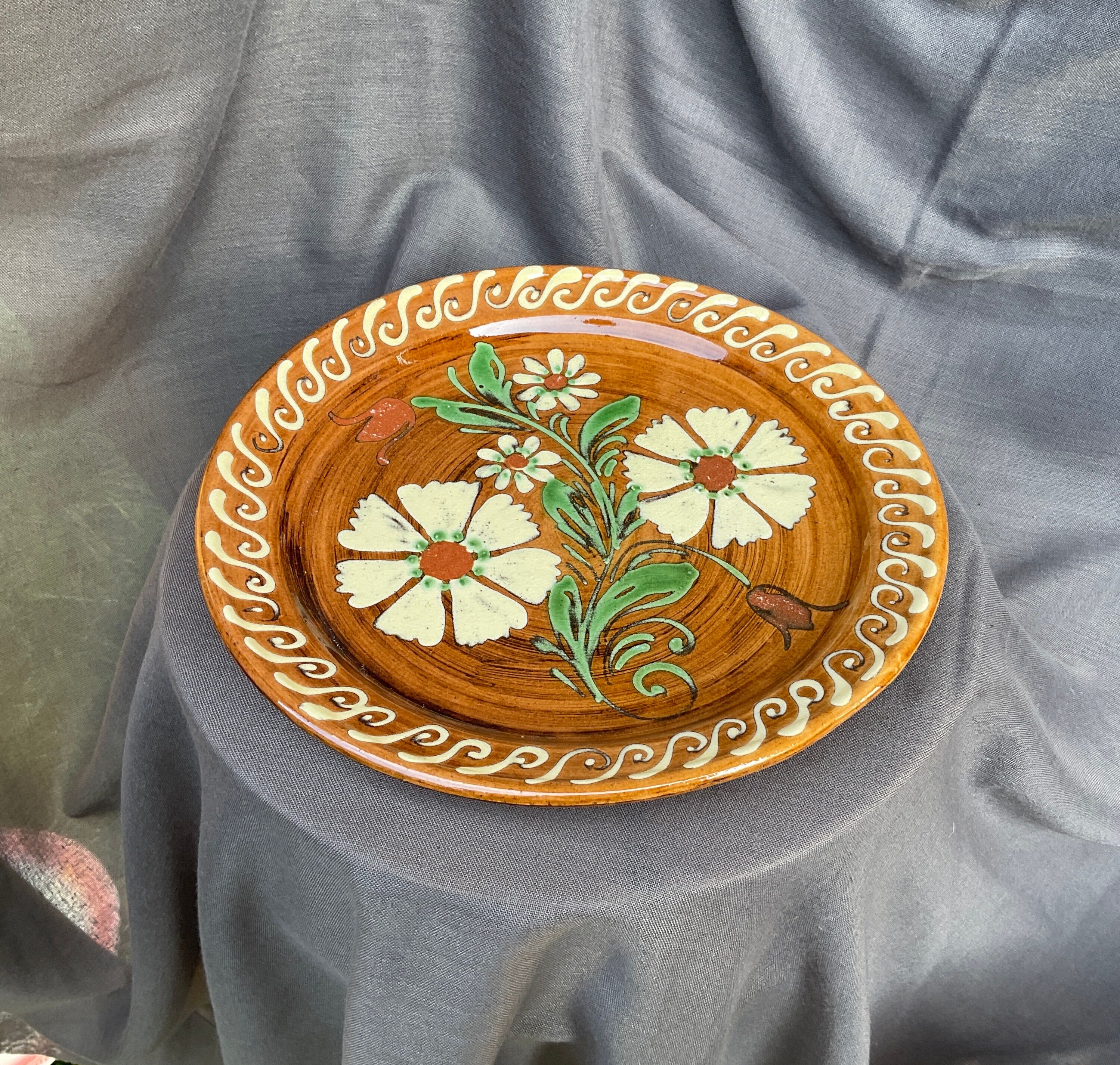 Terracotta plate with floral decoration