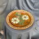 Terracotta plate with floral decoration