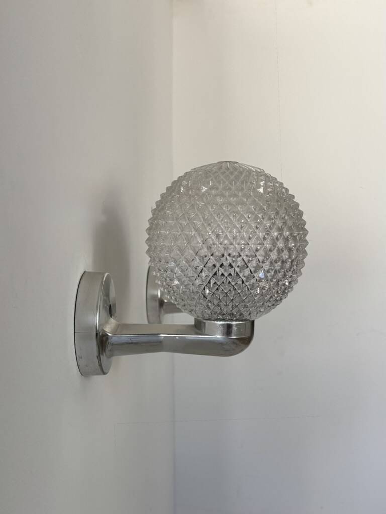 Pair of vintage wall lights in chrome metal and pressed moulded glass, France, 70s.