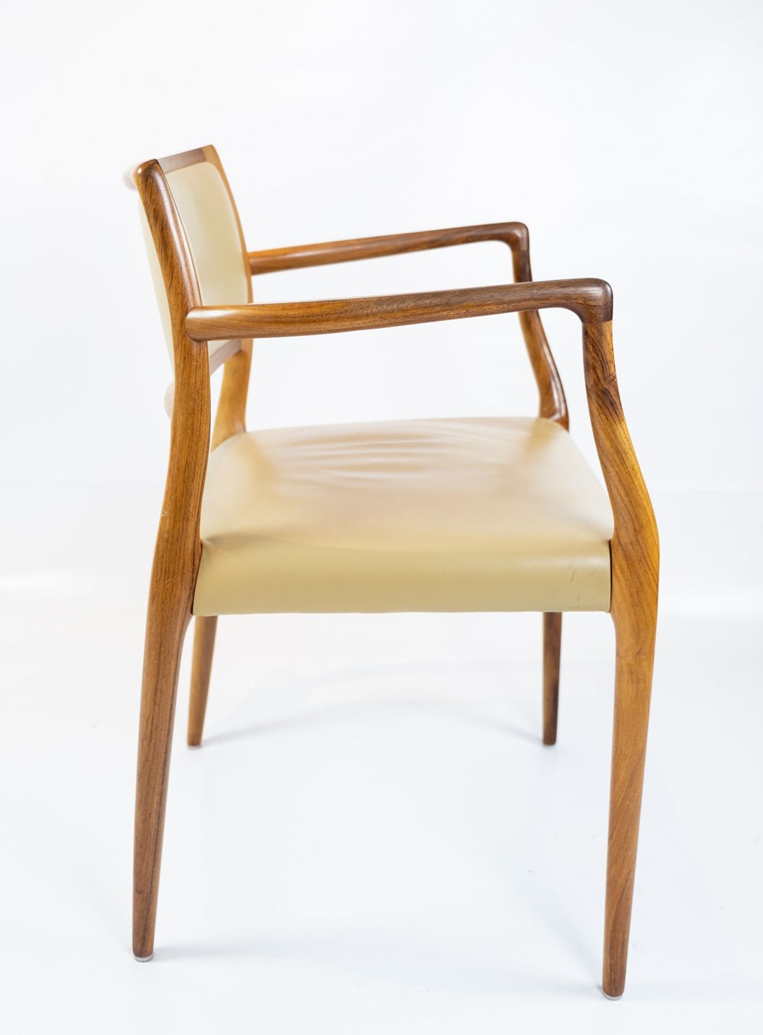 Pair of N.O. Moeller armchairs, model 65, in rosewood and light leather
