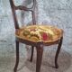 Carved walnut Napoleon III style velvet medallion chair