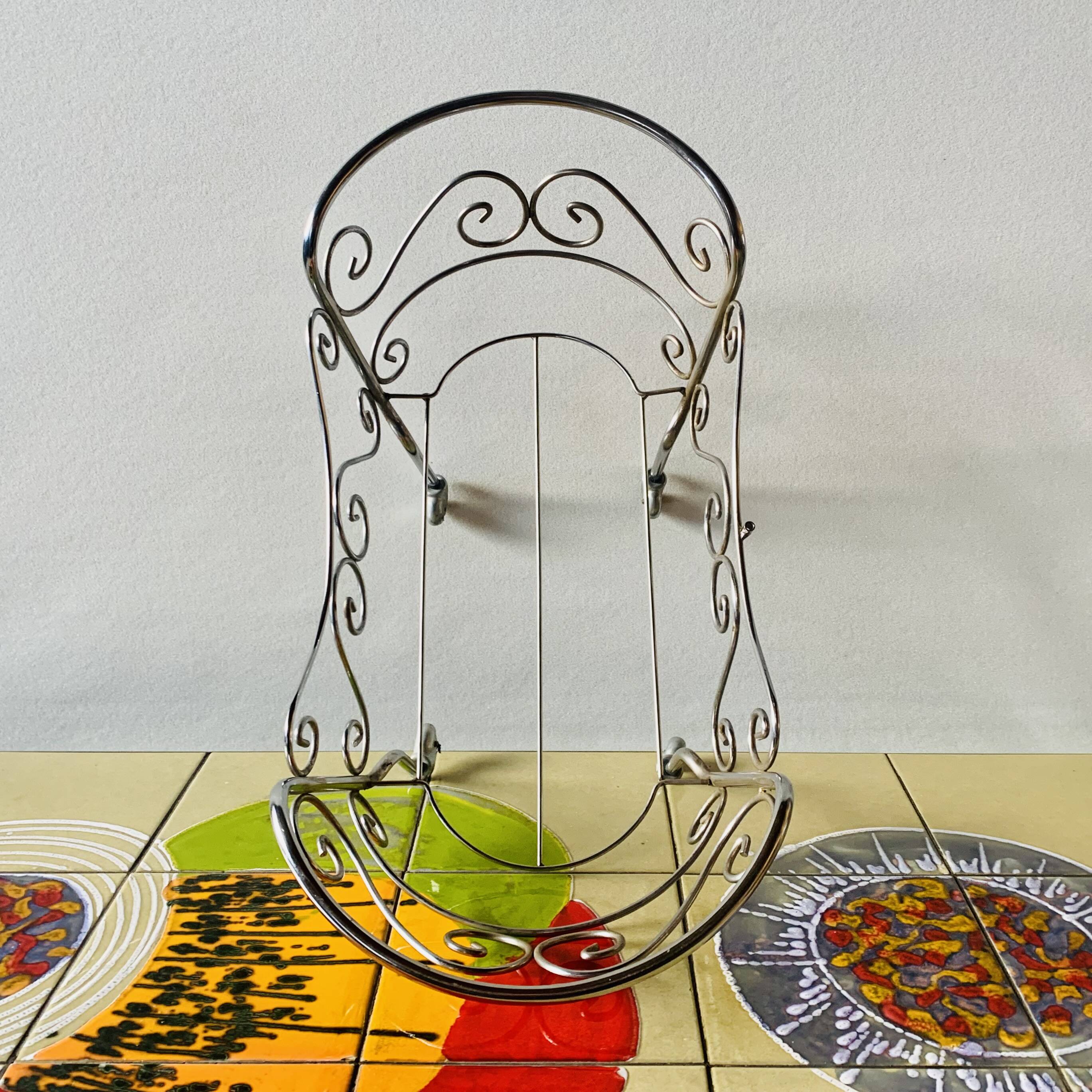 Metal doll's bed on vintage casters