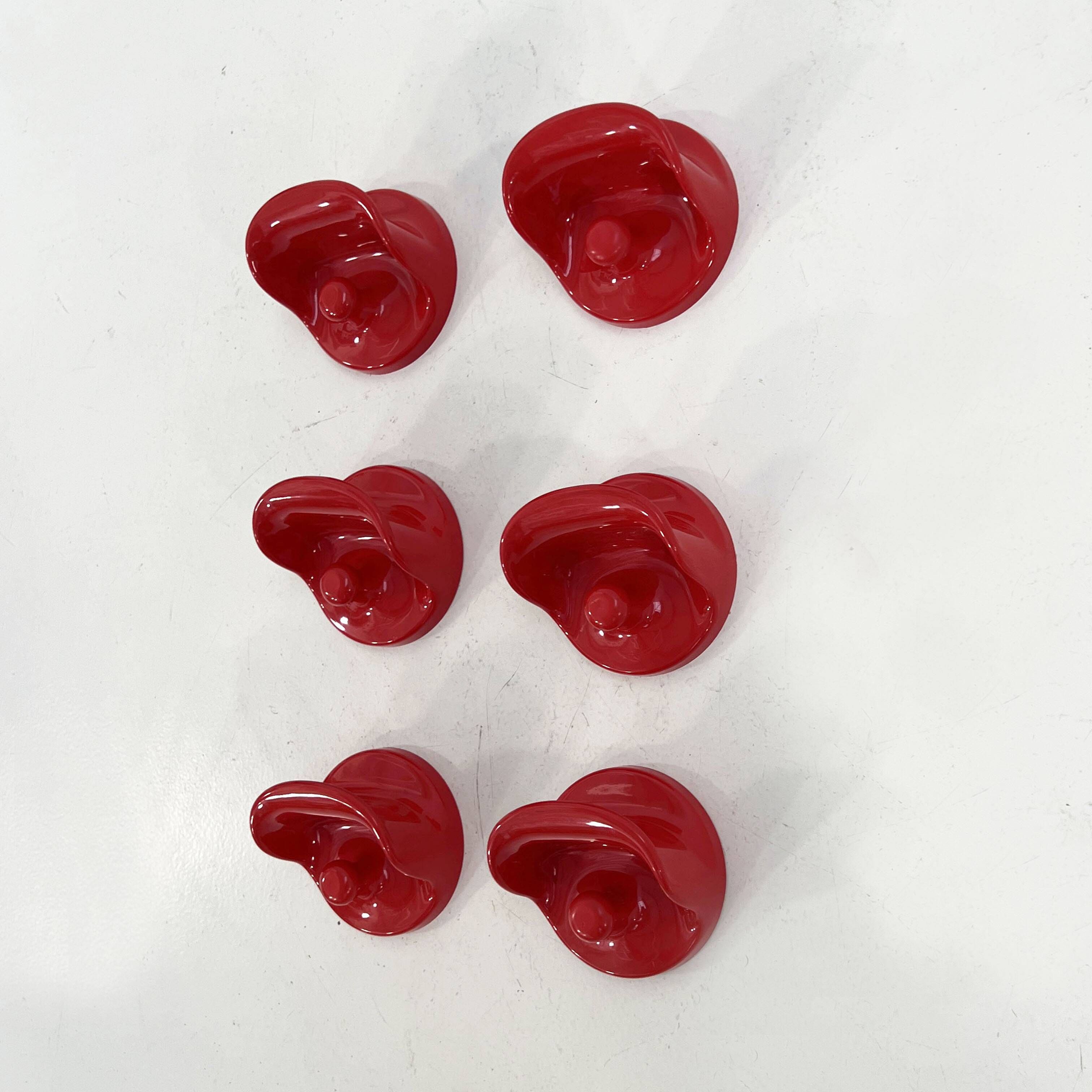 Set of 2 red "gancio 4702" coat hooks by olaf von bohr for kartell, 1970.