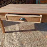 Low farmhouse table in raw wood