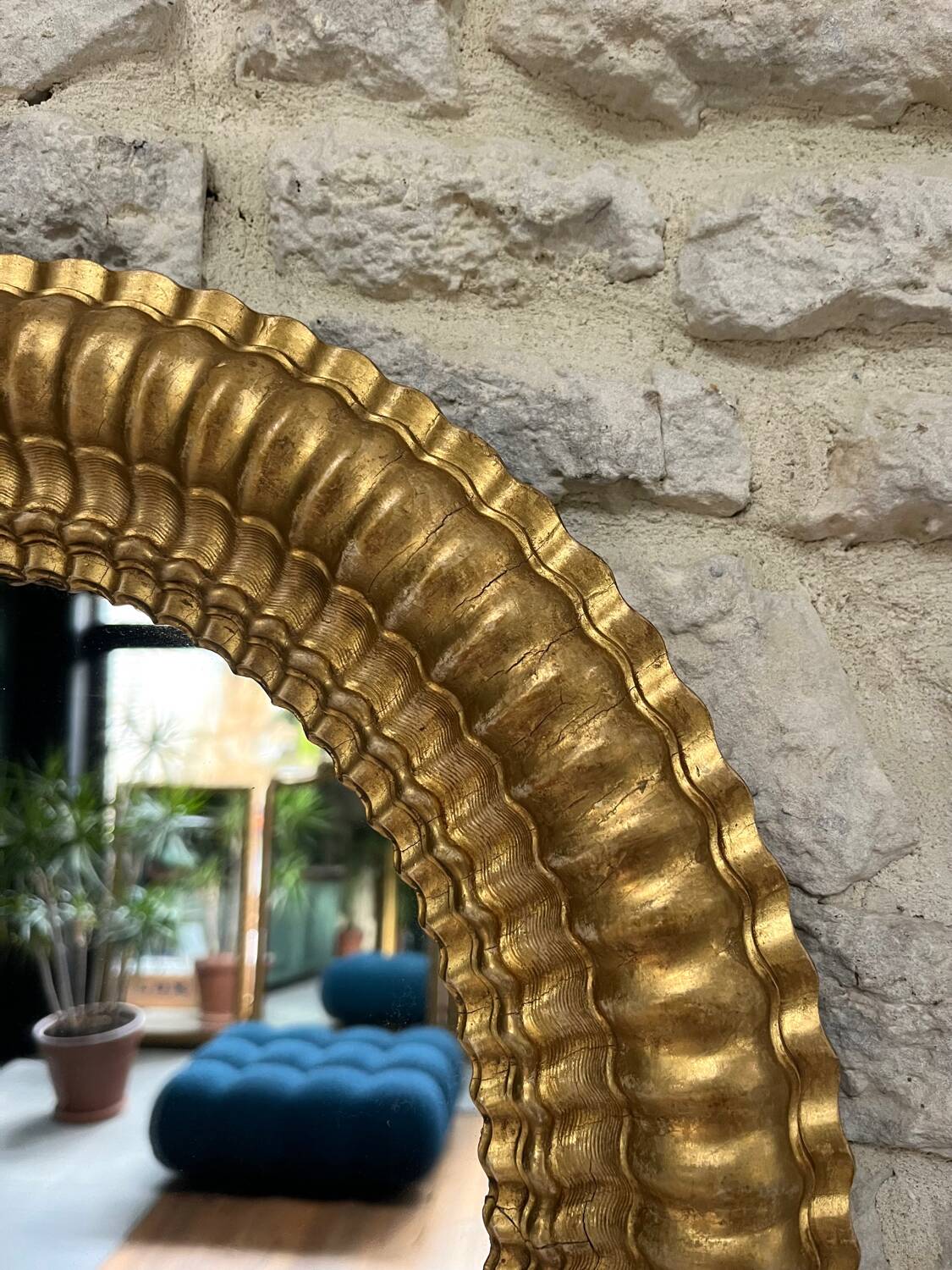 Pair of antique oval mirrors gilded with gold leaf and mercury.