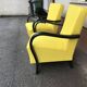 Pair of yellow Art Deco armchairs in cotton and wood, black frame, 1920s.