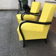 Pair of yellow Art Deco armchairs in cotton and wood, black frame, 1920s.