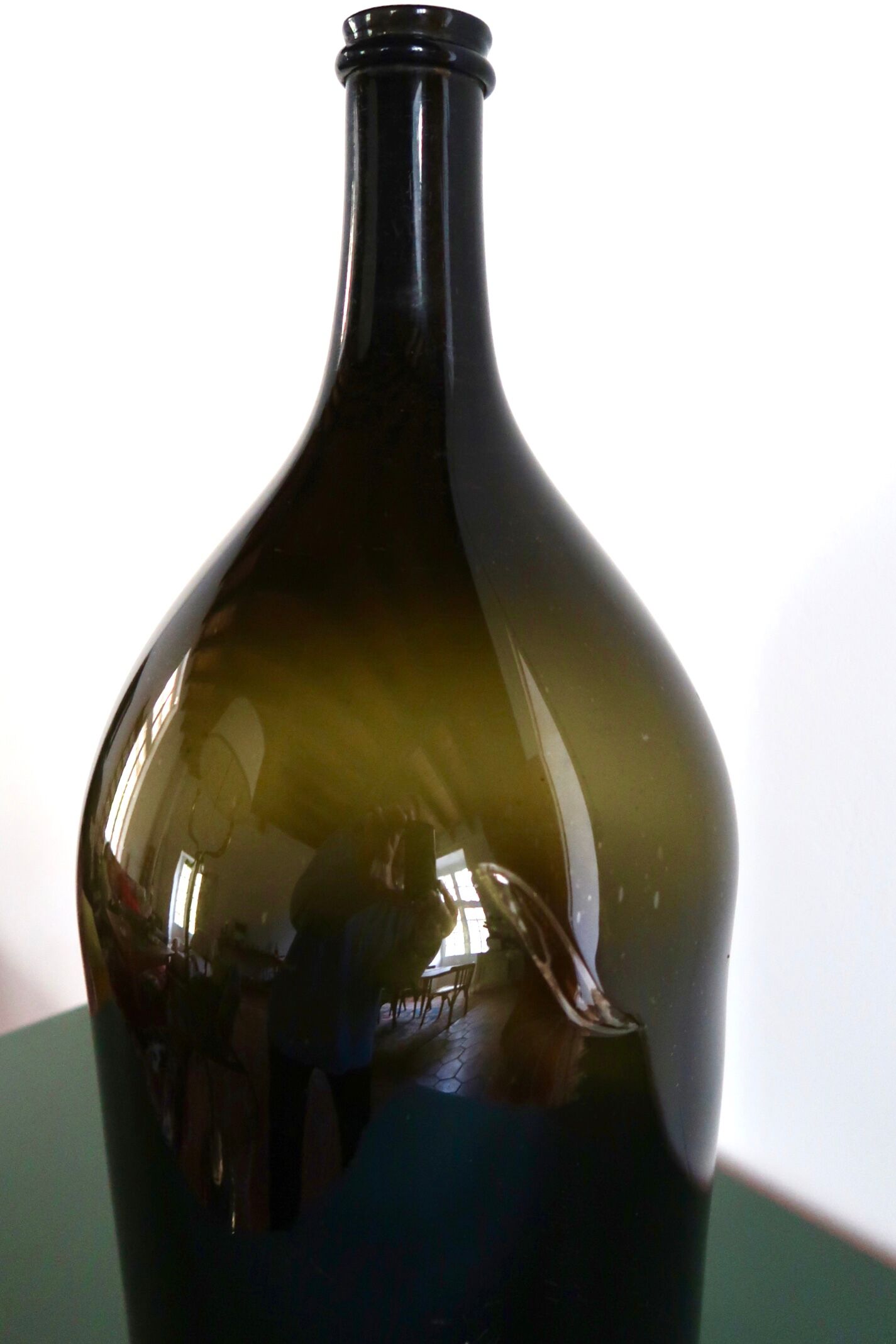 Large old bottle dame-jeanne dark green