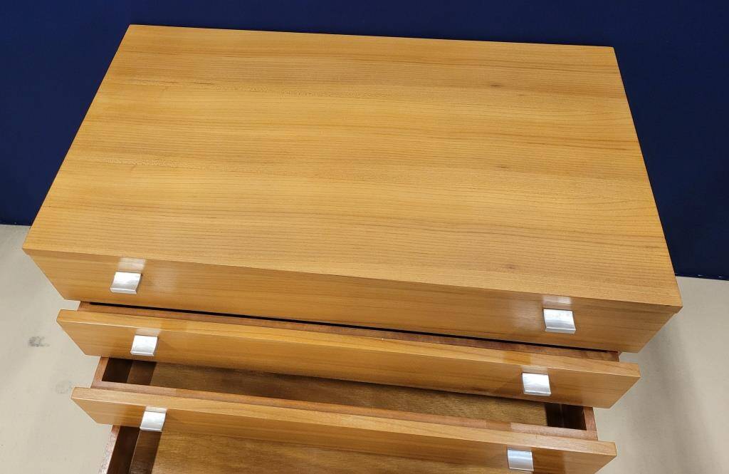 Solid wood chest of drawers with chrome legs from the 1970s.