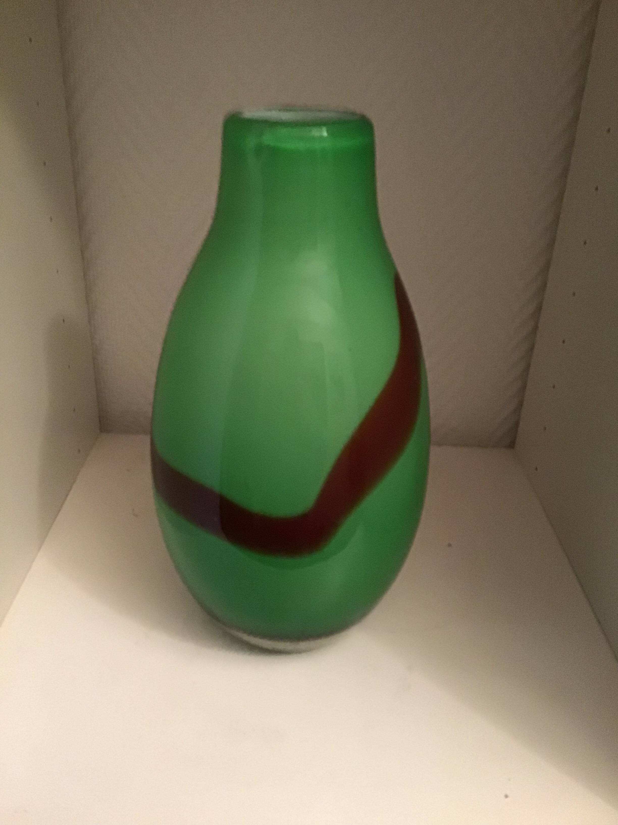 Very thick green glass vase with brown accents, very heavy, perfect condition.