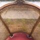 Louis XV style walnut and cane armchair