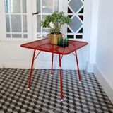 Red metal folding table Malaval type