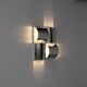Contemporary wall light in stainless steel and metal.