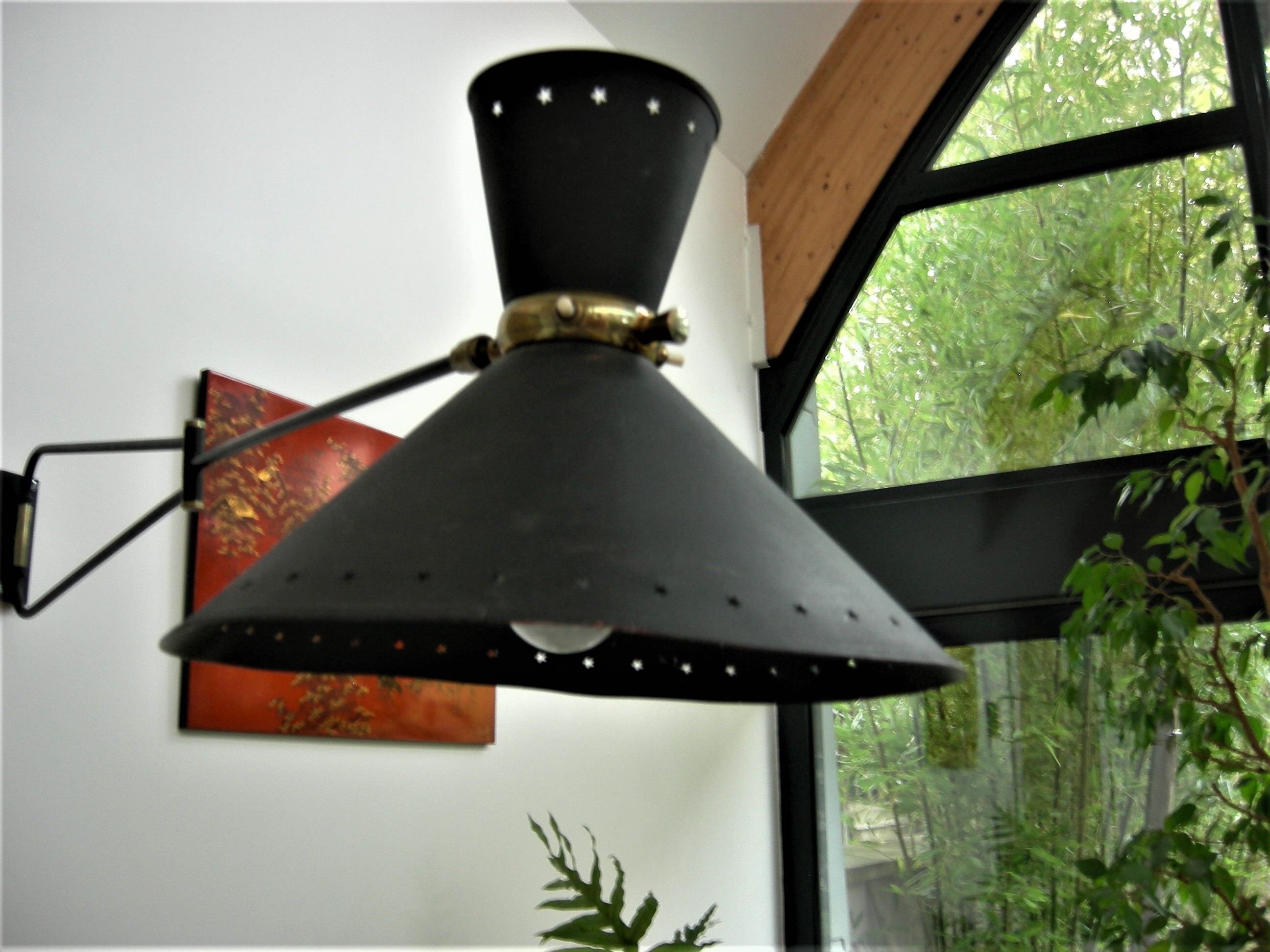 Roger Mathieu's diabolo sconce for Lunel with double lighting