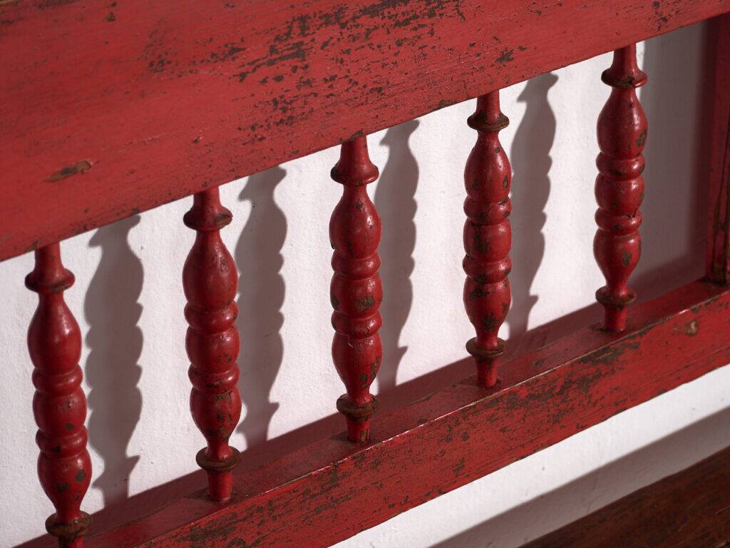 Old red-painted pine bench with turned backrest – Central Europe, circa 1900