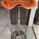 Orange tractor stool, pivoting adjustable mower, Fermigier Mirima 70.