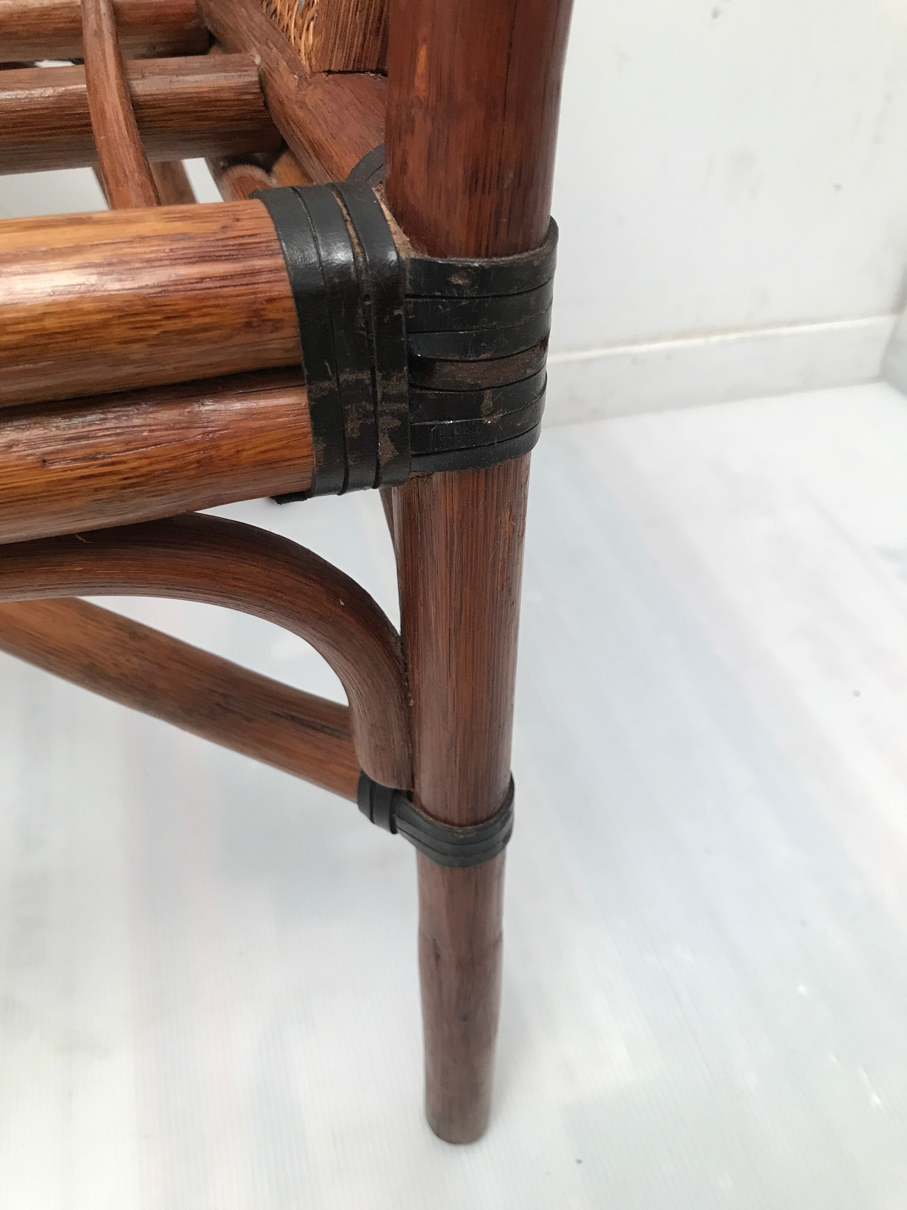 Rattan armchair with its footrest 70s