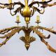 Golden luster with 12 arms of light decorated with leaves 1940