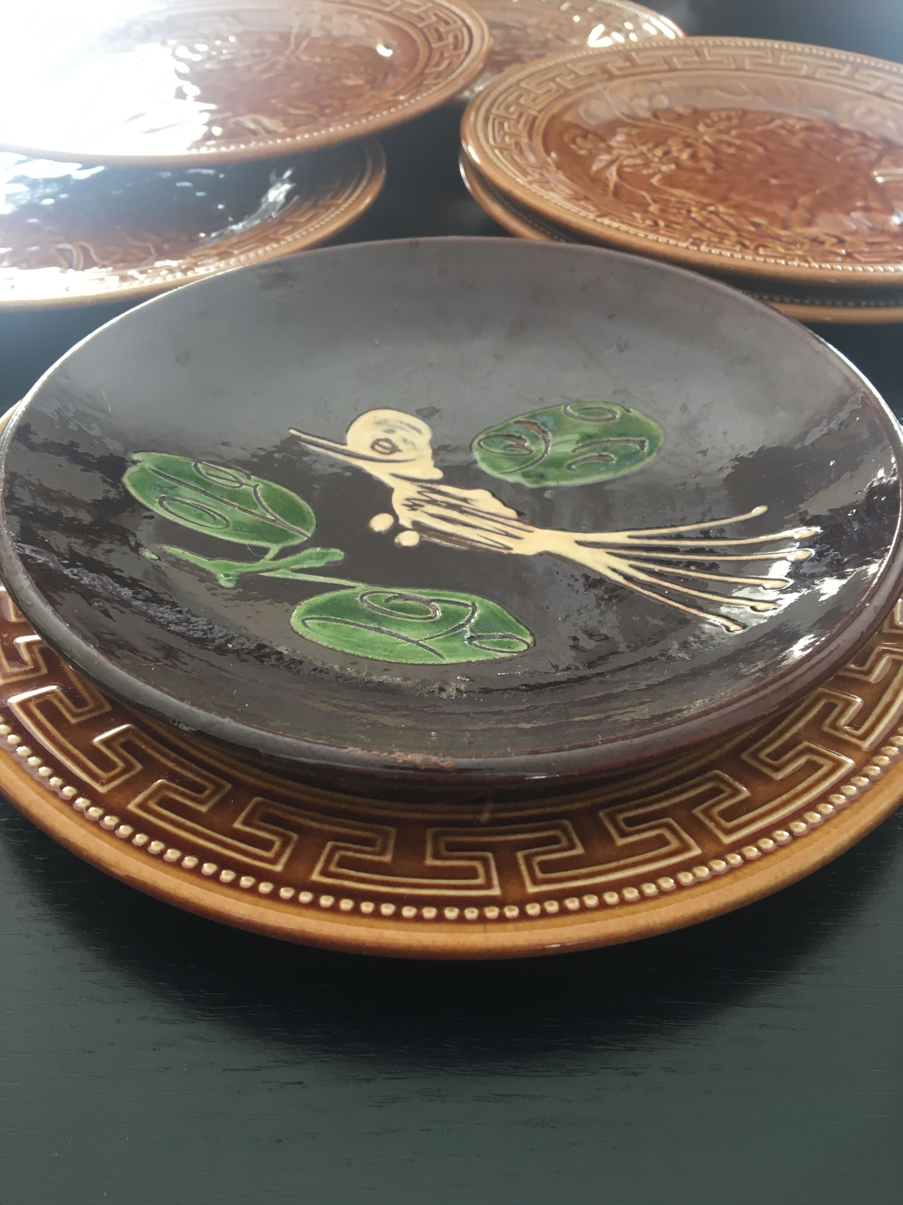Four decorated ceramic plates