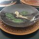 Four decorated ceramic plates