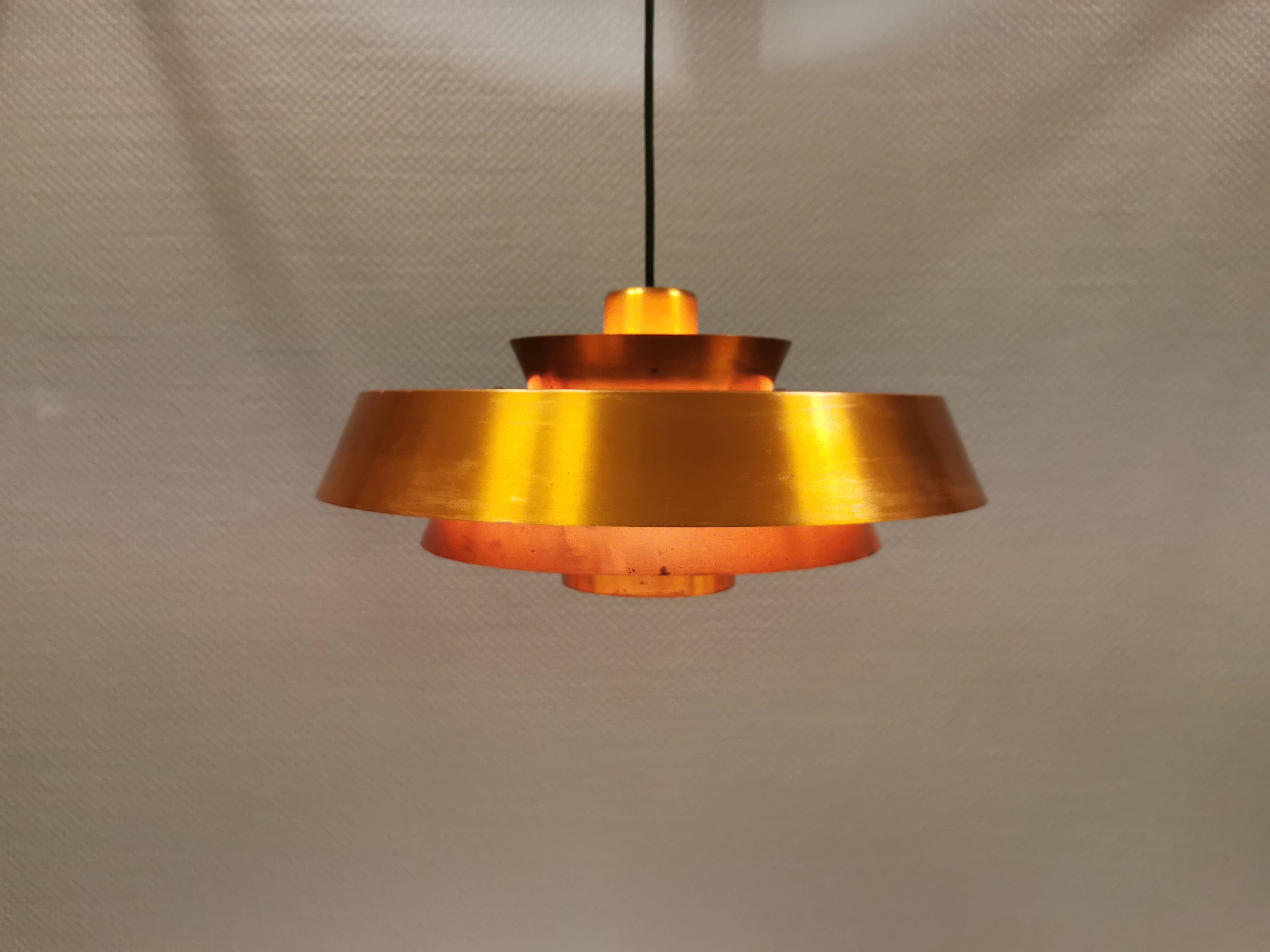 A mid-century Danish hanging lamp in copper by Jo Hammerborg for Fog & Mørup.