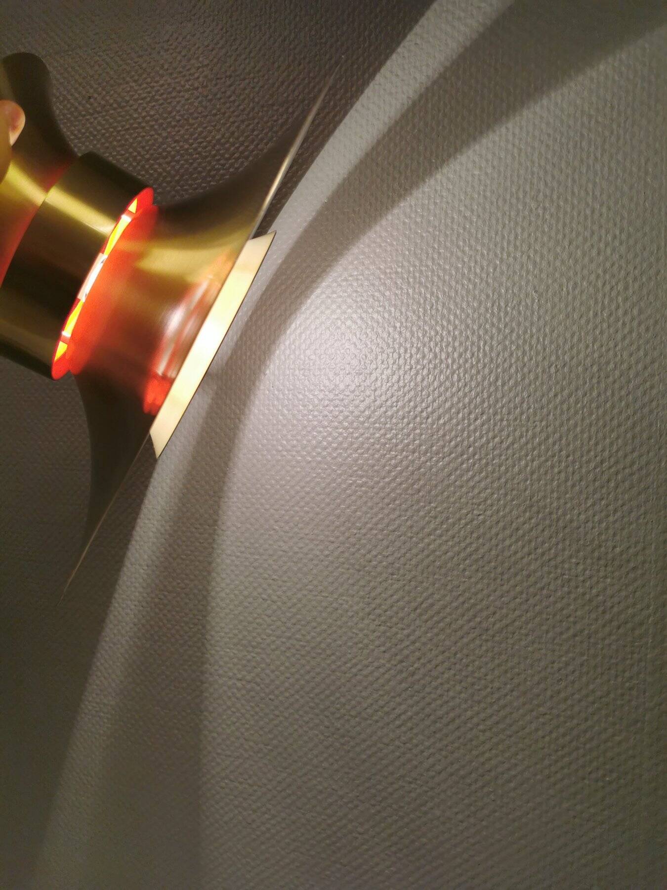 Large hanging lamp, made of brass-coloured aluminium with red and white contrast lacquer inside.