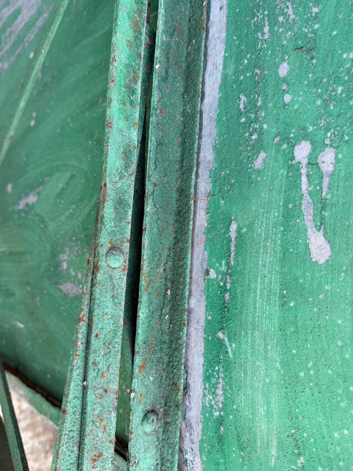 Bistro tables and folding chairs with a patina from the original 1930s.