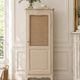 Vintage beige wardrobe made of wood and jute fabric.