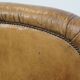 Fauteuil ancien en cuir de mouton