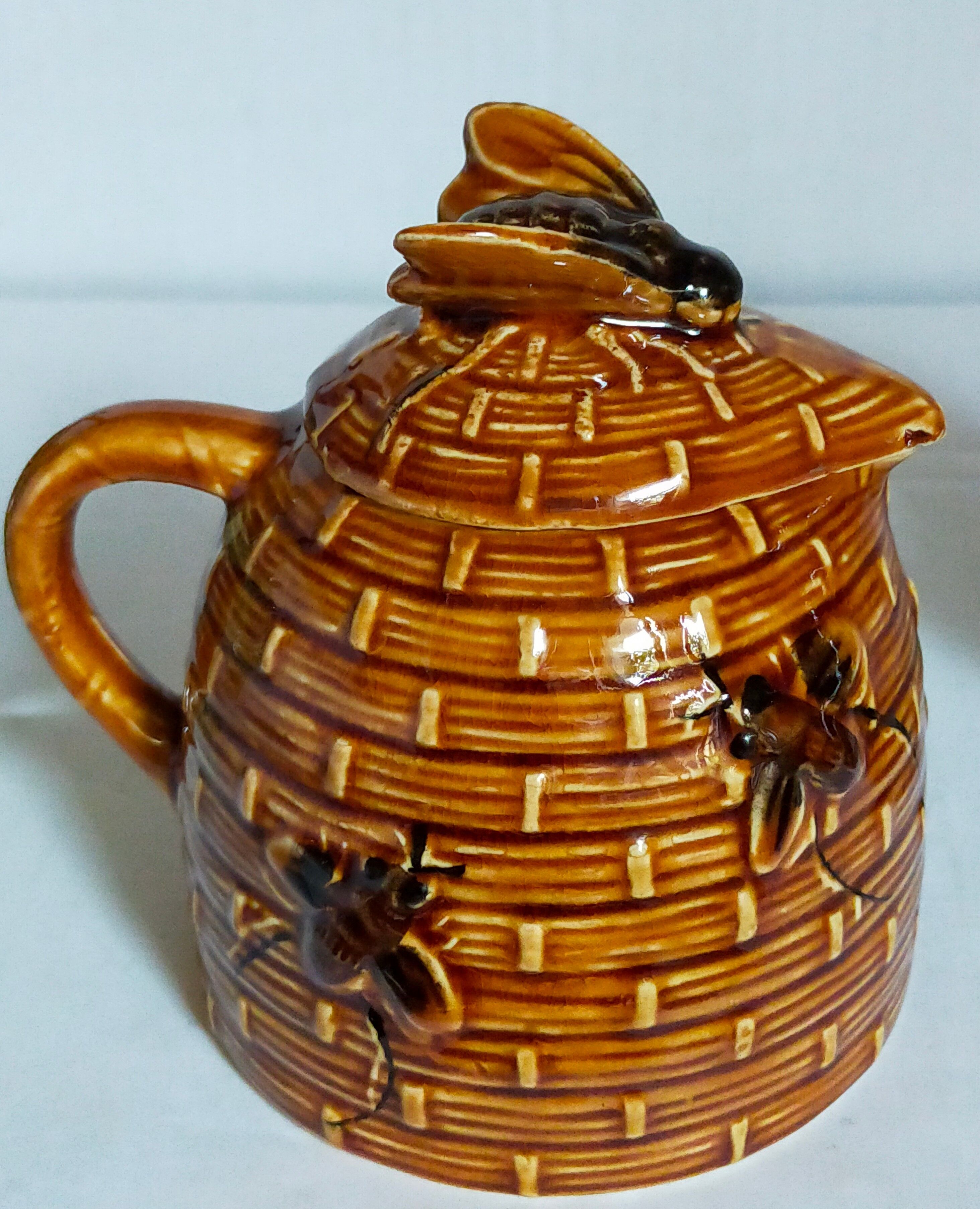 Set of old teapots and honey pot