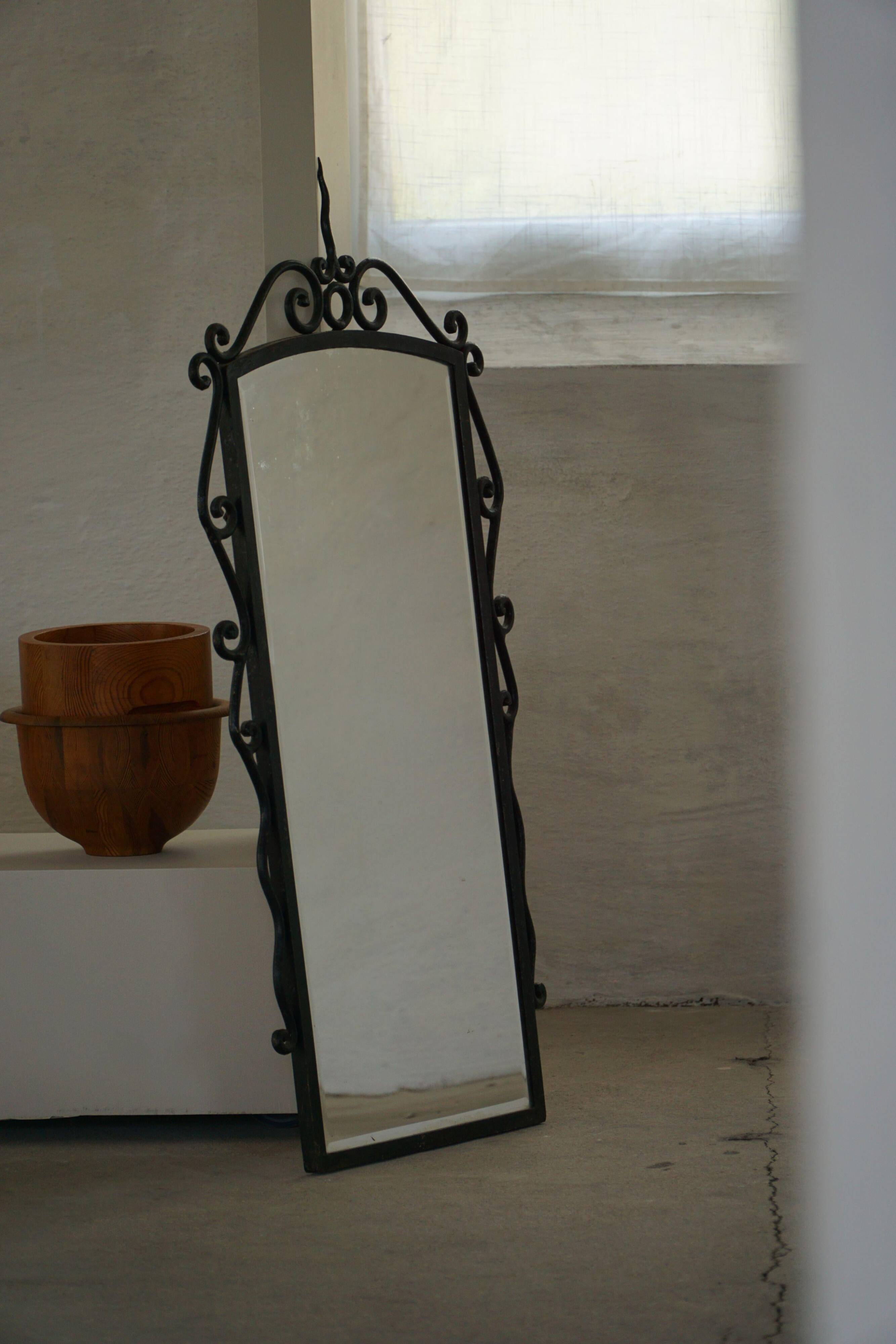 French mid-century brutalist wall mirror in wrought iron, made in the 1950s.
