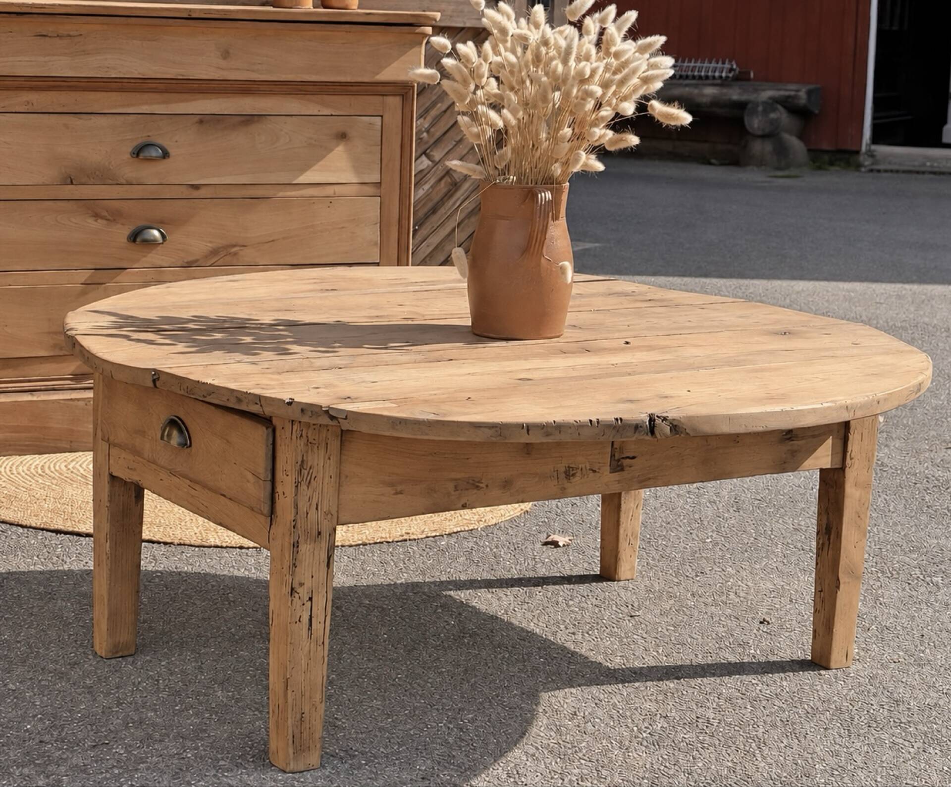 Round coffee table with 1 drawer, antique, made of raw solid wood.