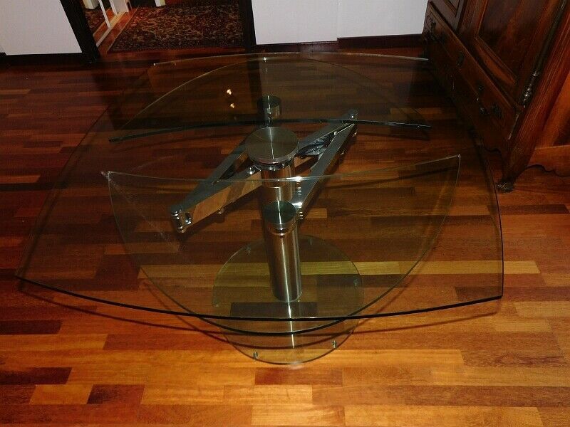 Glass and stainless steel dining table with 2-length system