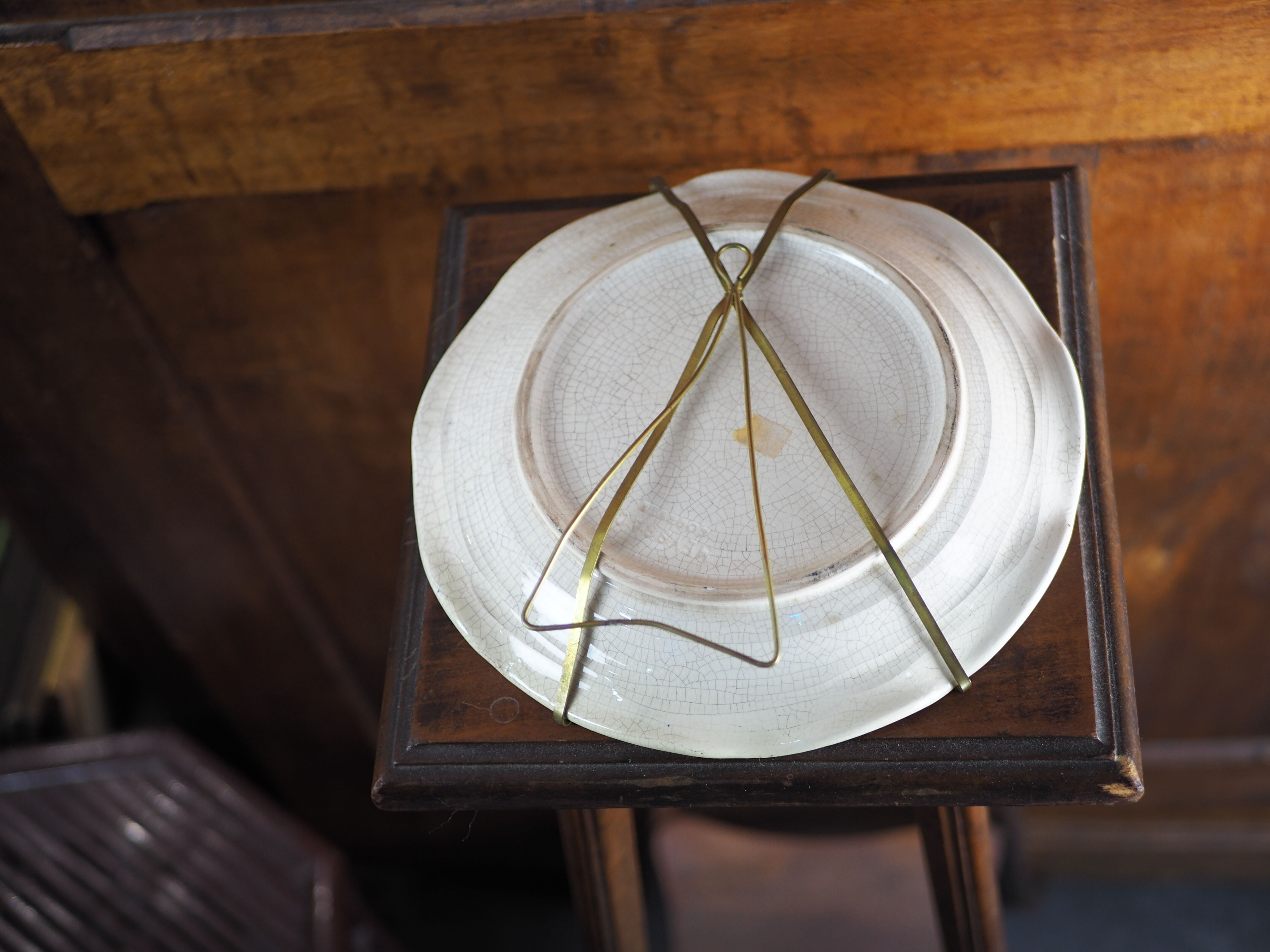 Meyssac plate decorated with flowers on cracked background early twentieth century and its support