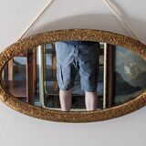 Art Deco oval mirror in gilded wood, France circa 1920