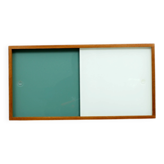 A vintage mid-century wall hung oak cabinet, green & white glass doors
