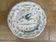 Hollow plate in Moustiers faience decorated with a bird, 19th century.