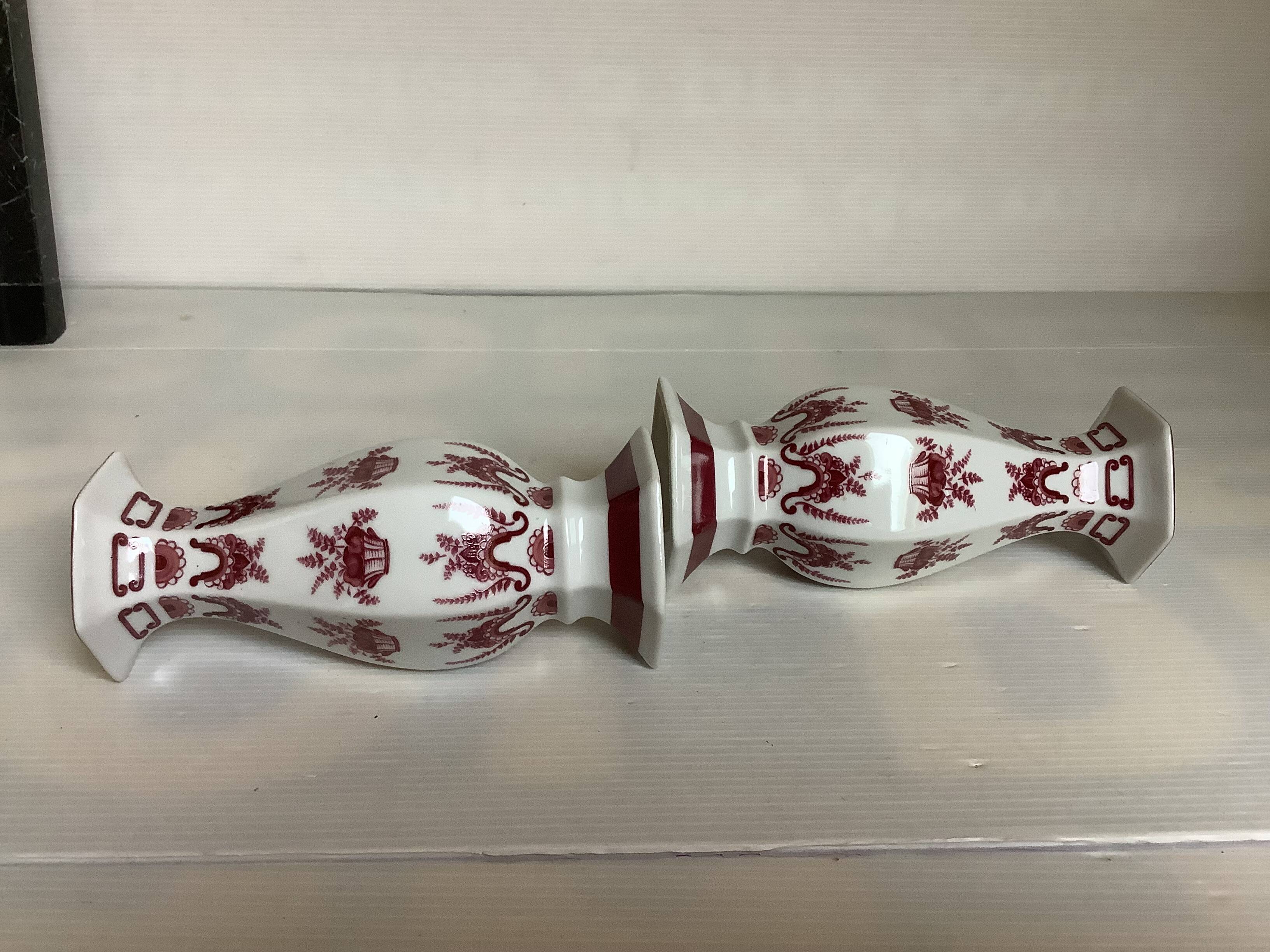 Pair of hexagonal burgundy candlesticks