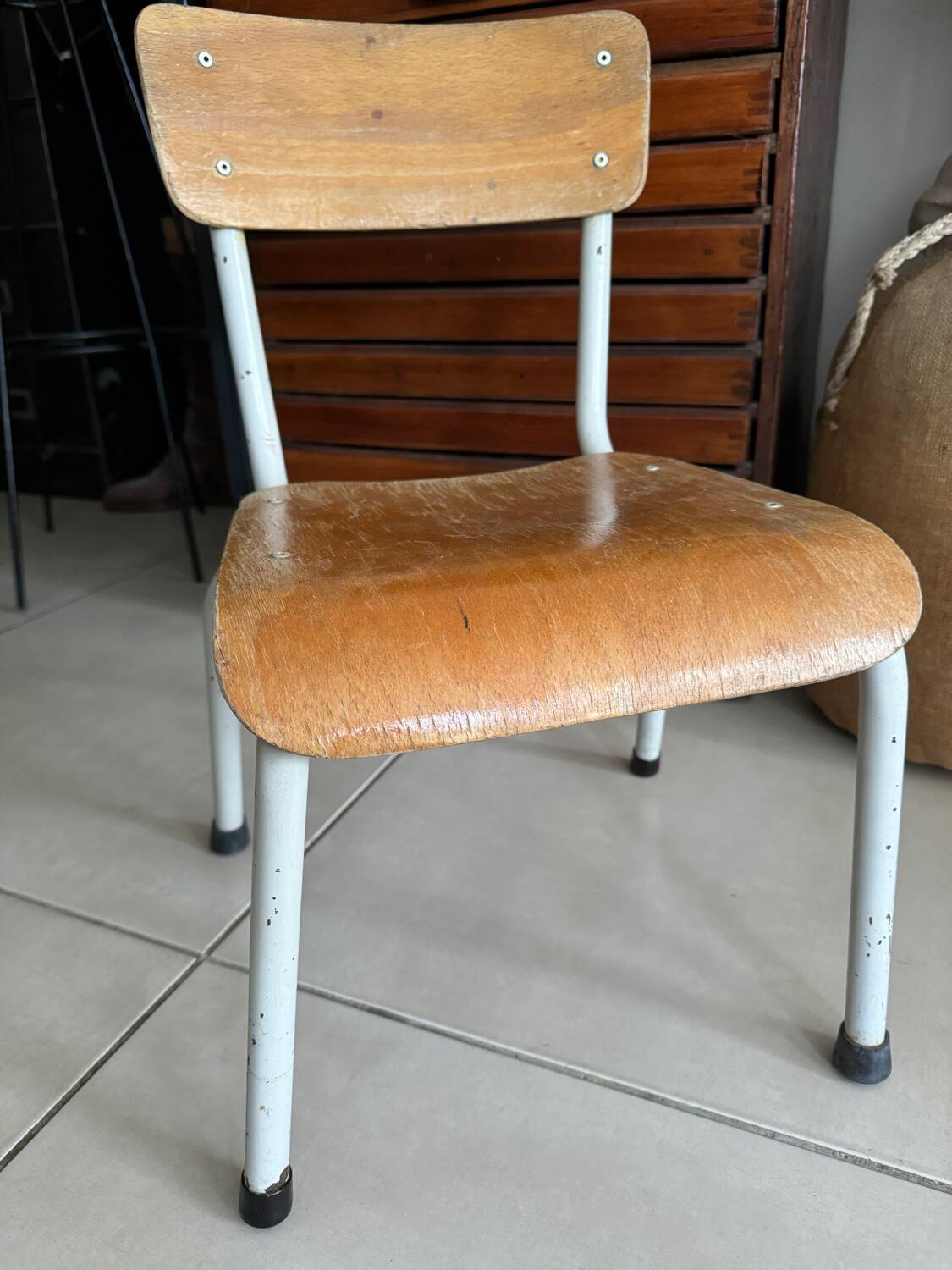 Old wooden and metal children's school chair