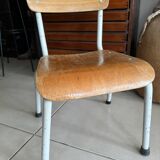 Old wooden and metal children's school chair