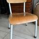 Old wooden and metal children's school chair