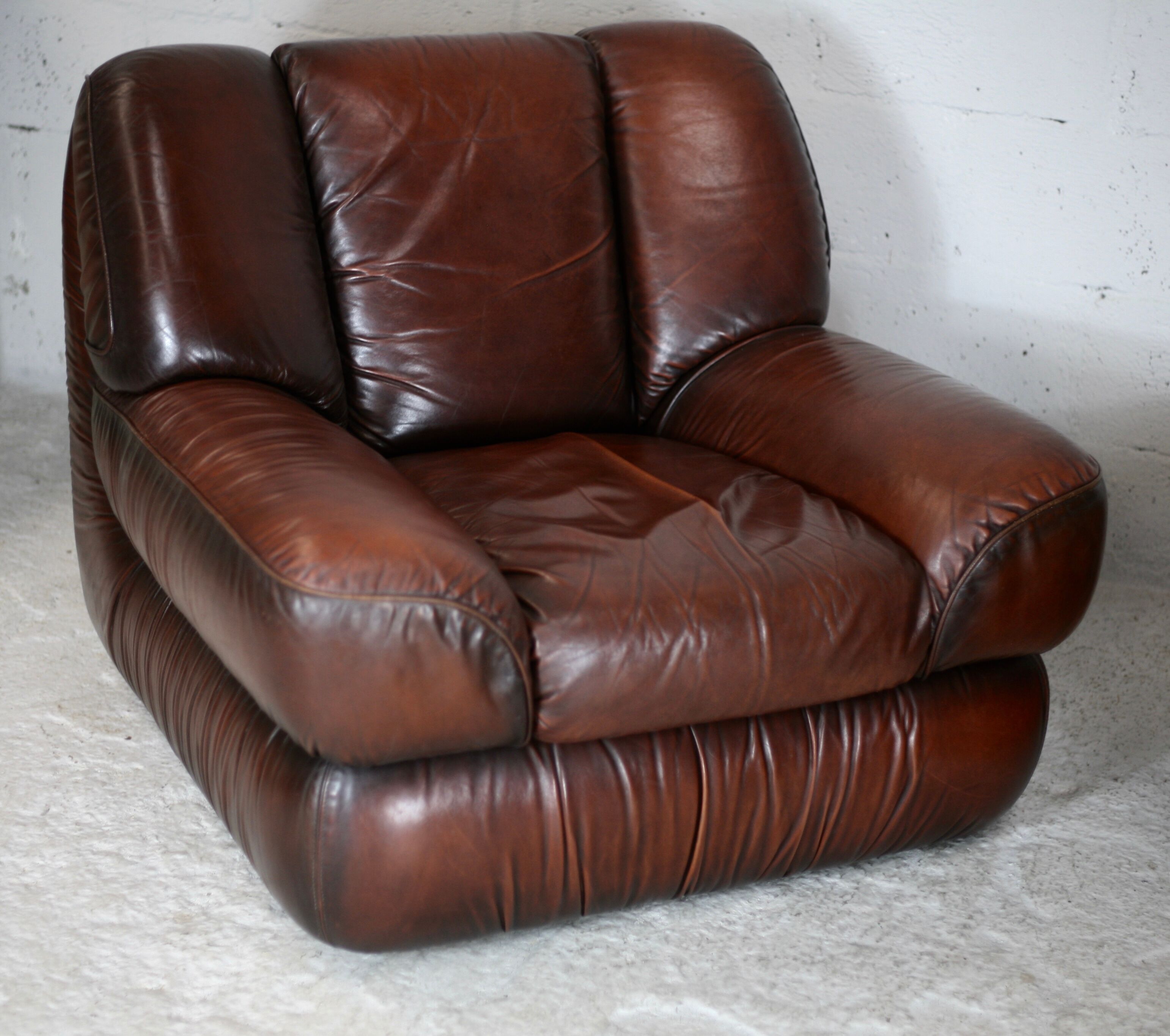 Leather armchair and coffee table set, Italy, circa 1970. Space Age