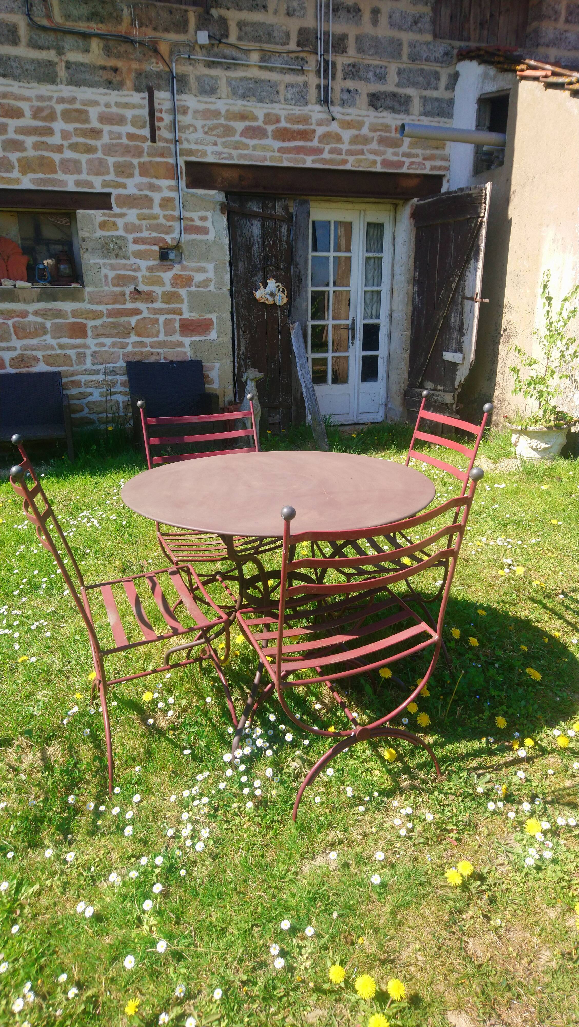 Garden table + 4 wrought iron chairs