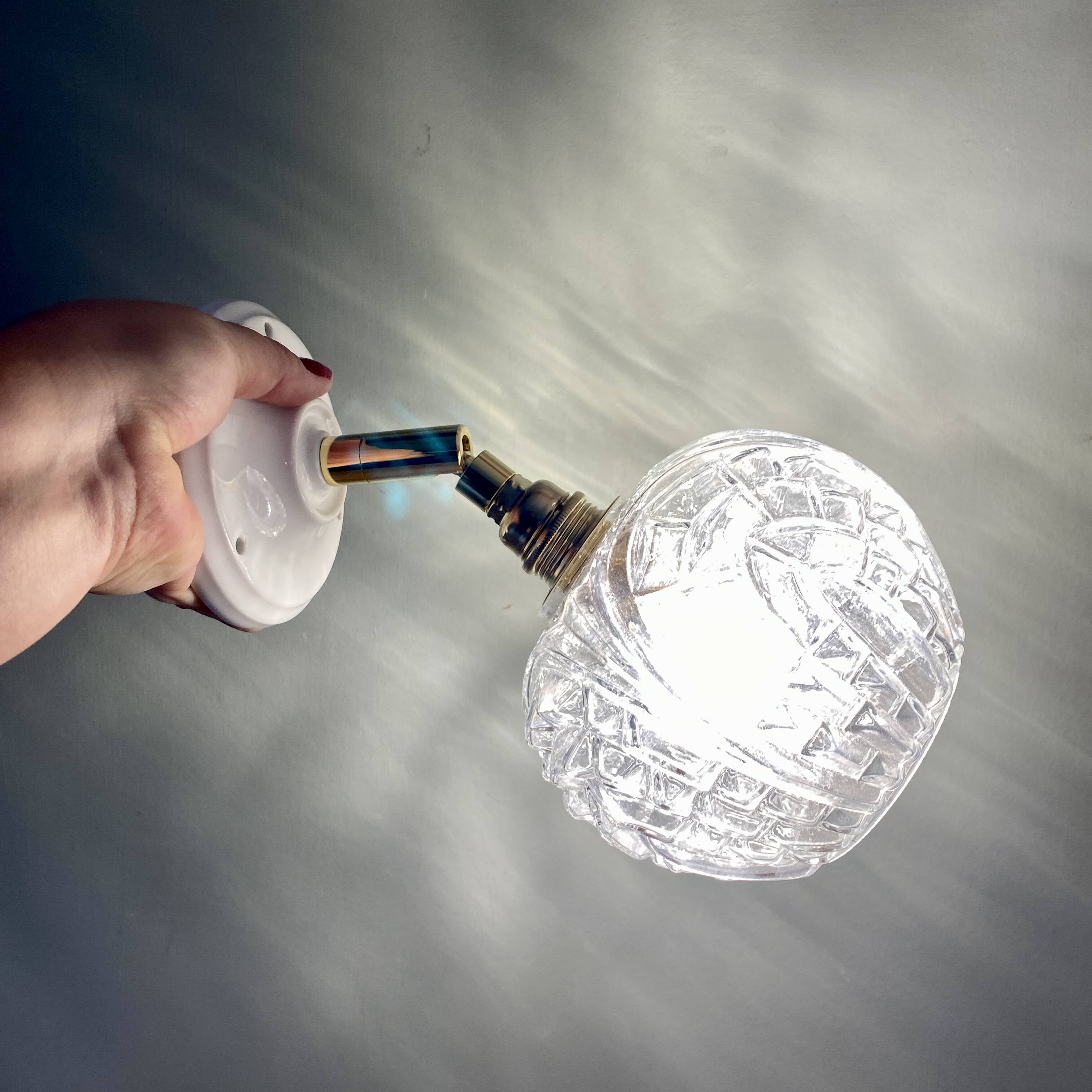Vintage moulded glass globe wall light