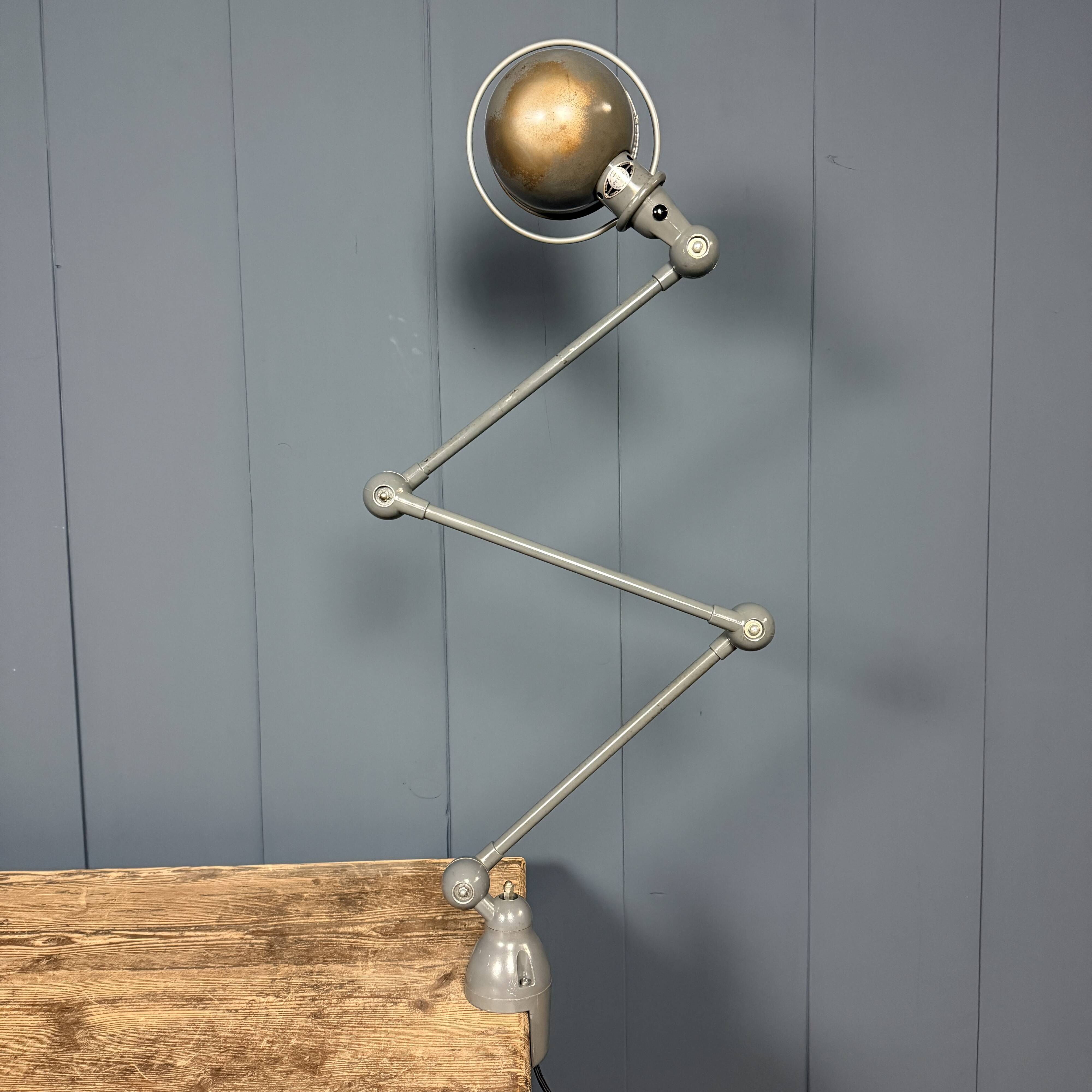 Dark grey Jielde three-arm clamp table lamp
