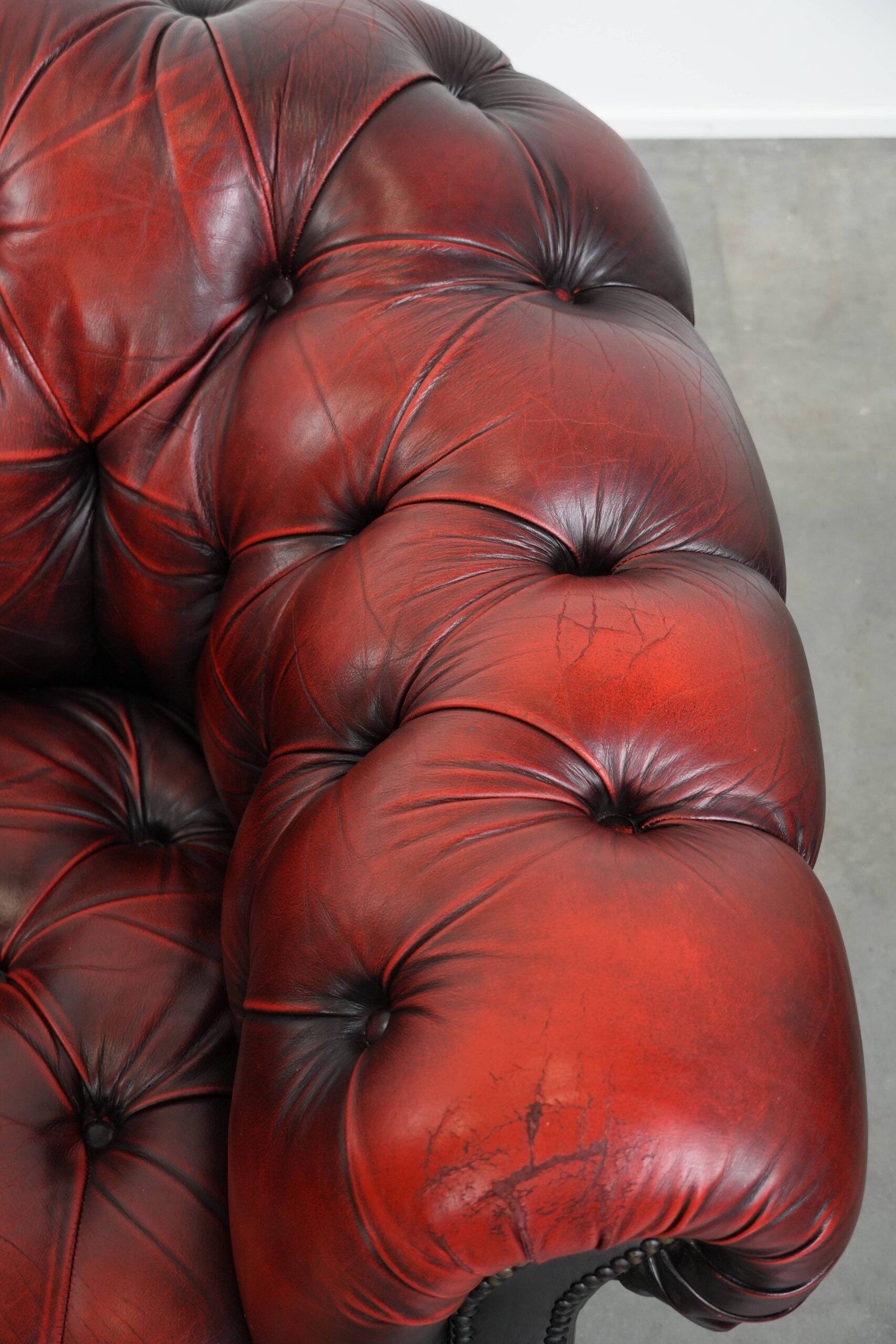 Classic cowhide Chesterfield button seat armchair in a beautiful red colour