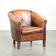 Vintage sheepskin club armchair finished with black piping