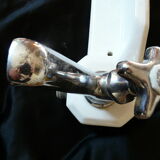 Old ceramic bathroom shelf with 2 chrome bronze faucets