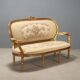 Neoclassical canapé in gilded wood